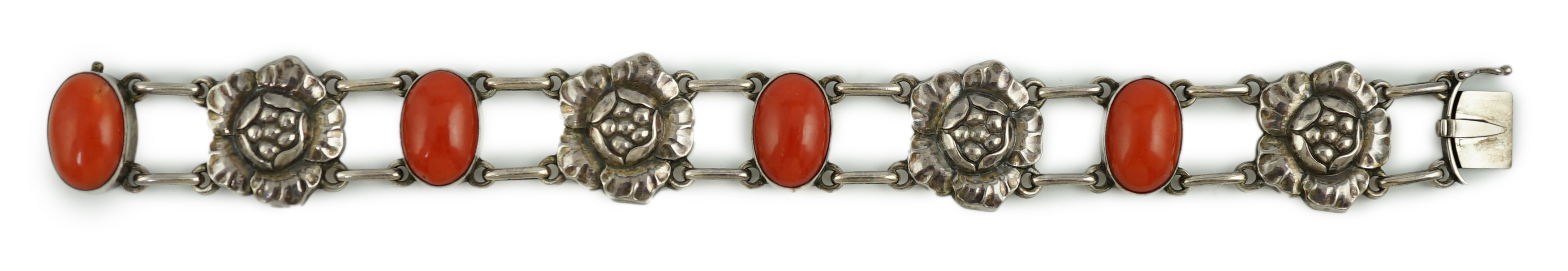 A George Jensen sterling silver and four stone cabochon coral set bracelet